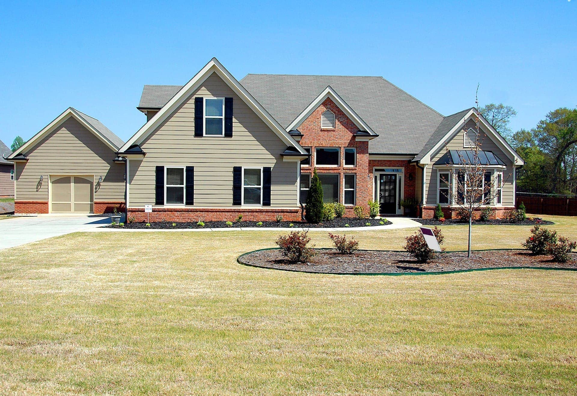 suburban home with brick and shiplap exterior